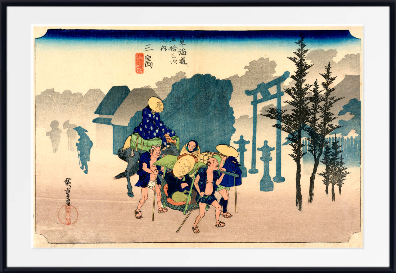 A framed Japanese ukiyo-e woodblock print showing a group of figures carrying a person in a basket outdoors, with torii gates, trees, and a house in the background. The print is mounted with a white mat and a black frame.