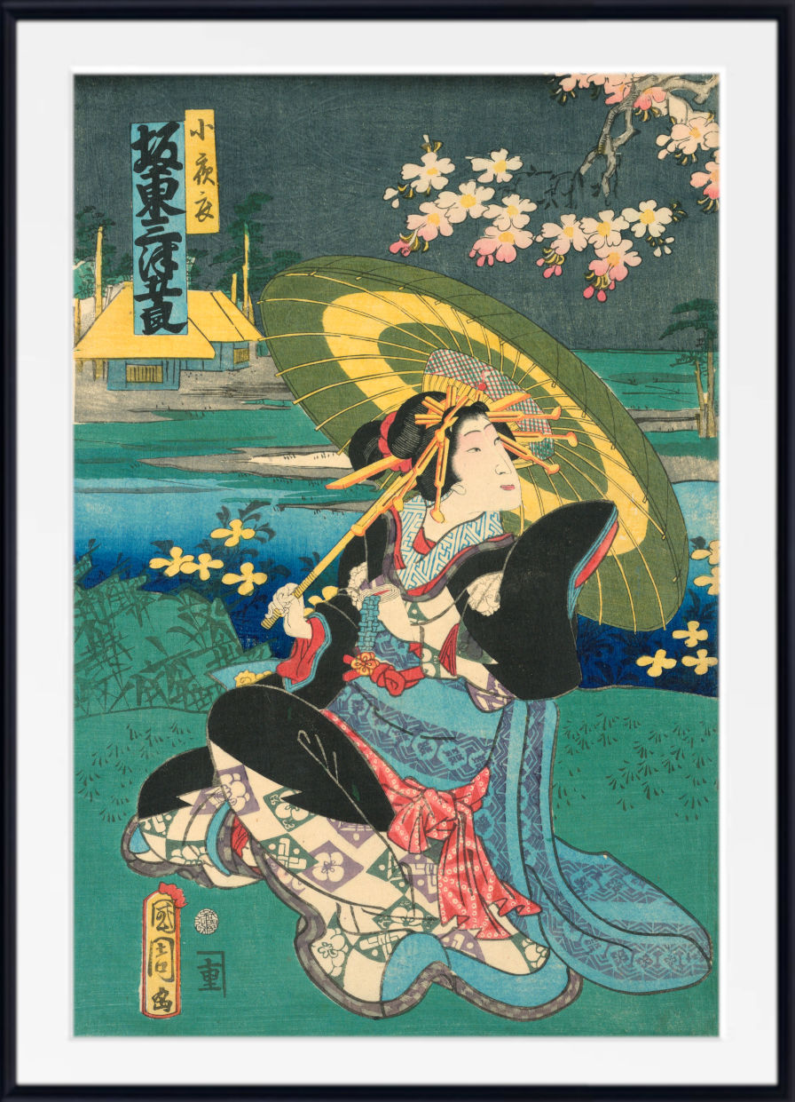 A framed Japanese ukiyo-e woodblock print featuring a woman in a blue and red kimono holding a green parasol, with cherry blossoms and a landscape in the background.