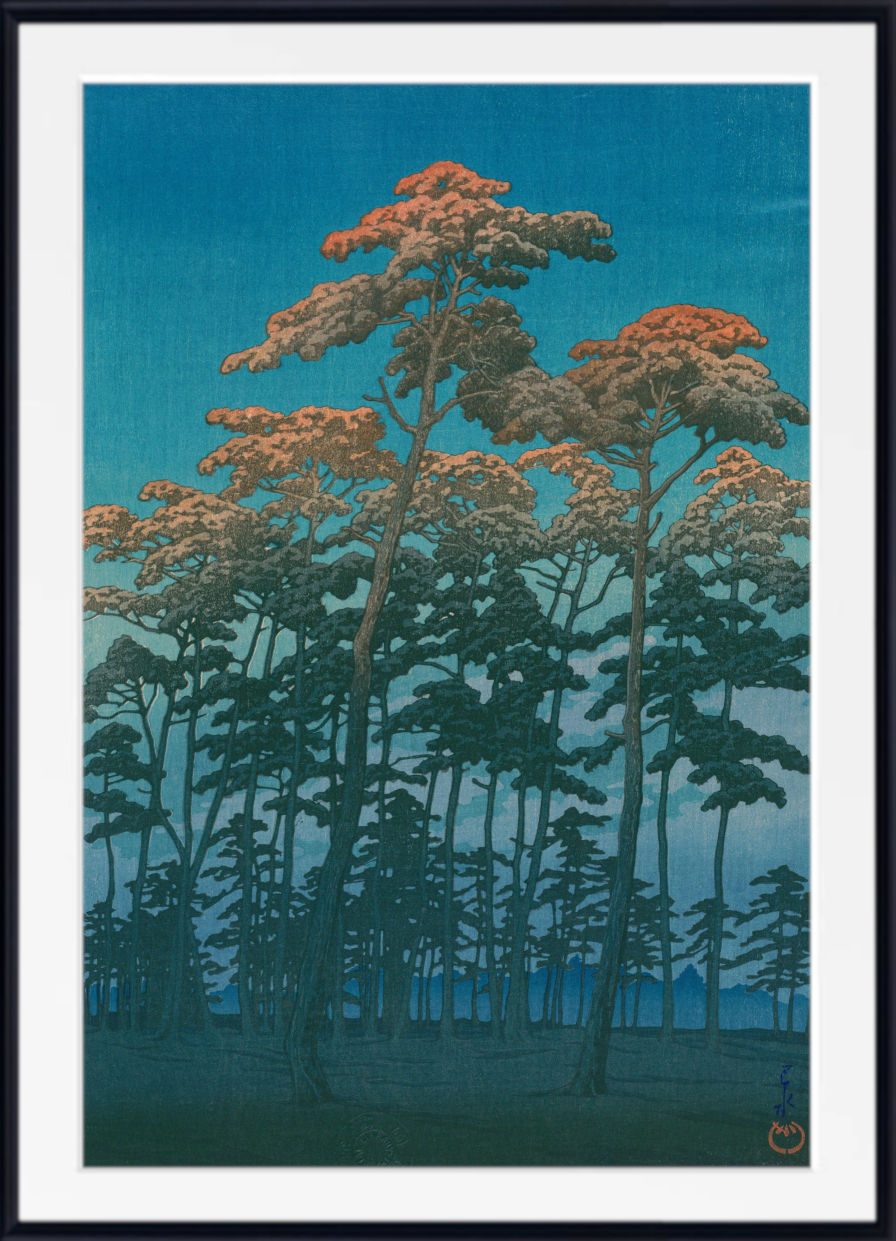 A framed Japanese-style art print depicting a forest of tall trees under a deep blue sky, with the trees showing warm orange and brown foliage. The print is presented with a white mat and a simple black frame.
