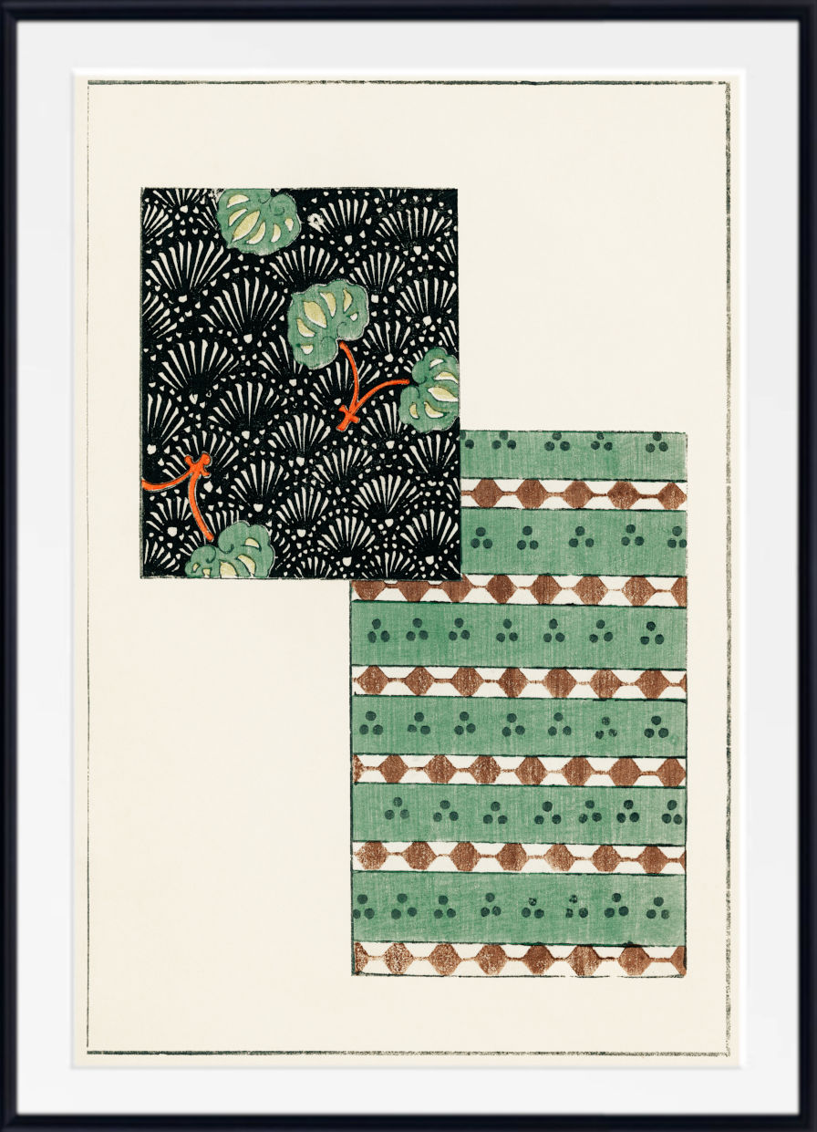Framed abstract art print featuring two geometric patterned blocks: one black with green leaf motifs and orange accents, and one green with brown diamond and trefoil patterns, set against an off-white background.