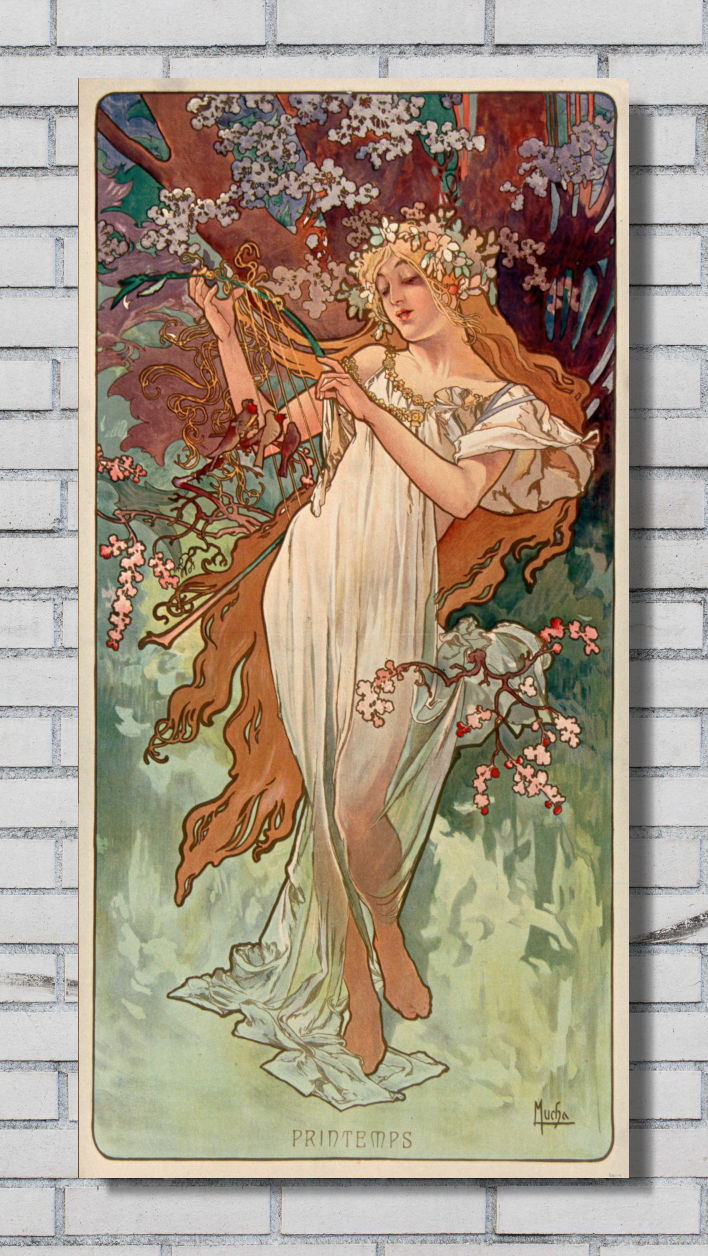 A vertical framed art print featuring an Art Nouveau illustration of a woman in a flowing white dress among blossoms and green foliage, displayed against a white brick wall.