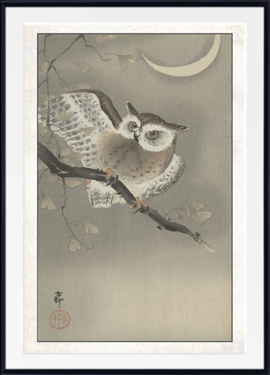 A framed Japanese-style art print depicting a detailed owl perched on a branch under a crescent moon, with a white mat and black frame.