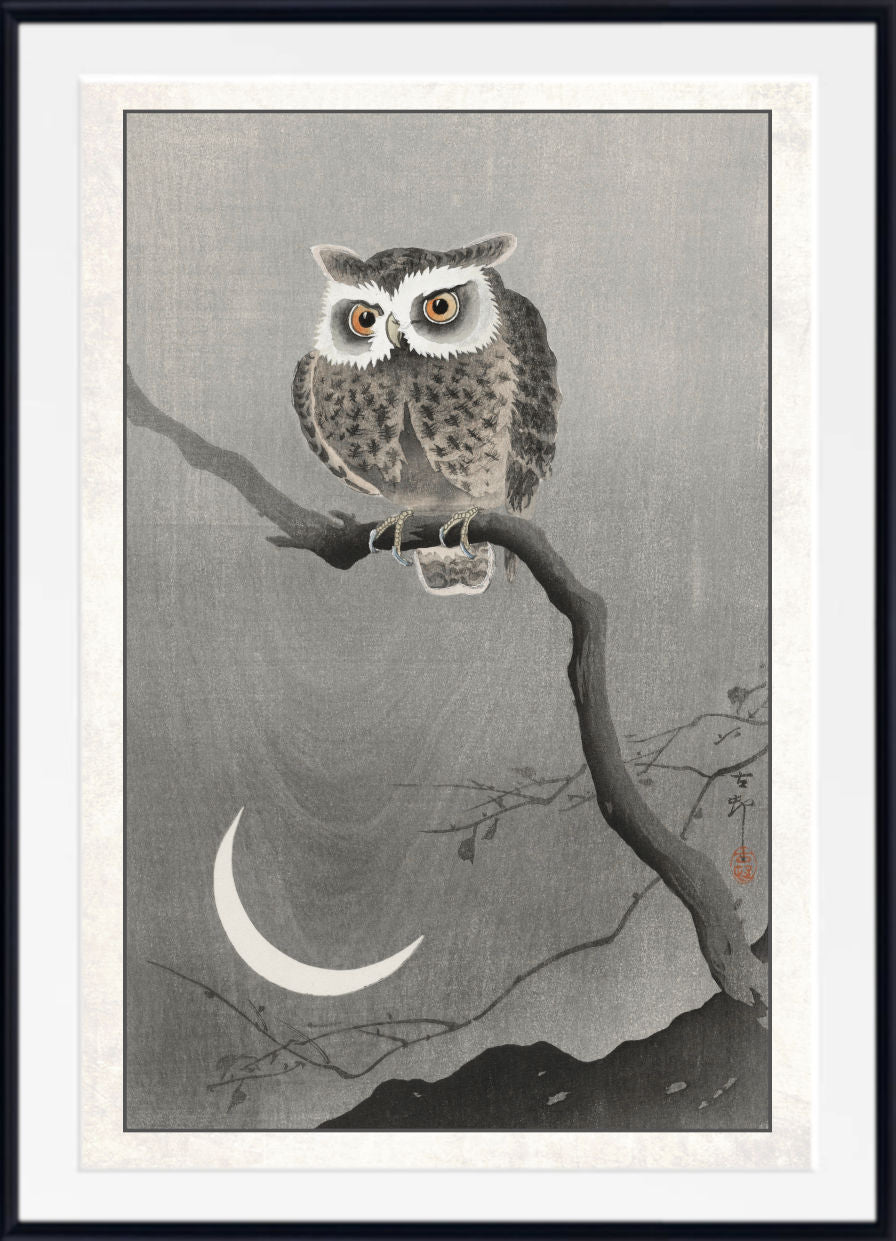 A framed Japanese-style art print featuring a detailed owl perched on a branch under a crescent moon, with a white mat and black frame.
