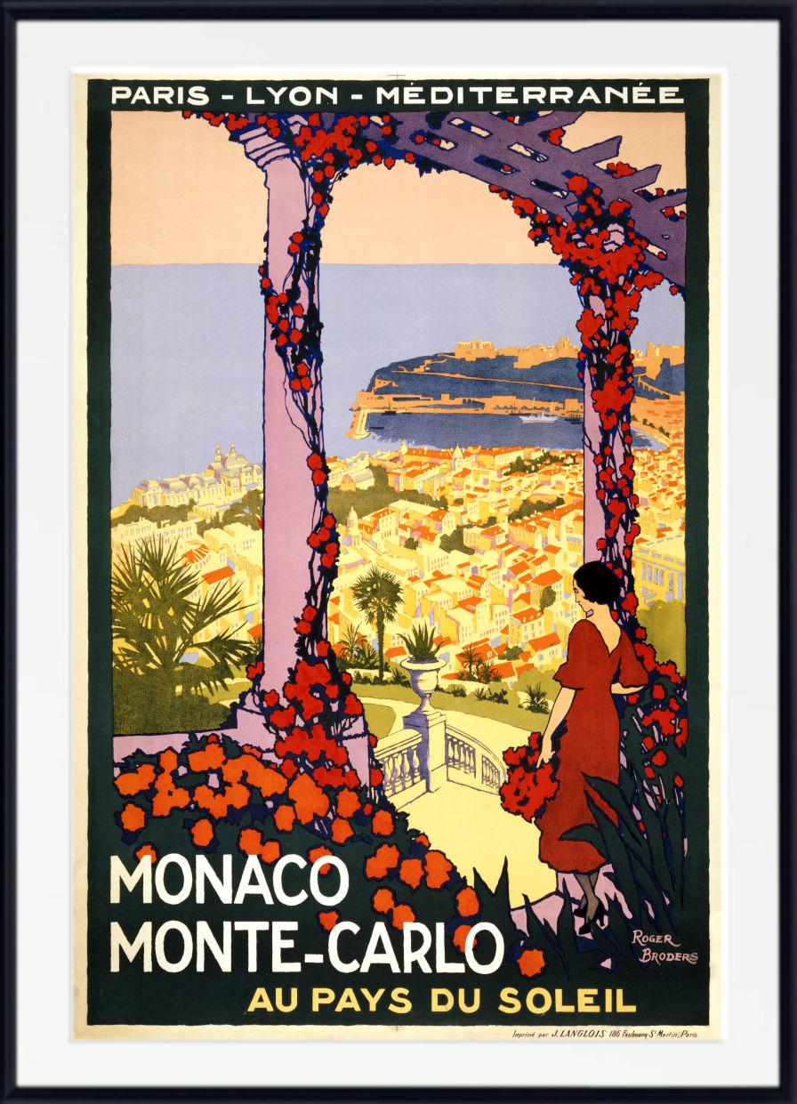 A vintage-style travel poster for Monaco and Monte-Carlo, framed with a white mat and black frame. The artwork shows a woman in a red dress standing beneath a floral archway overlooking a sunlit coastal city with blue water.