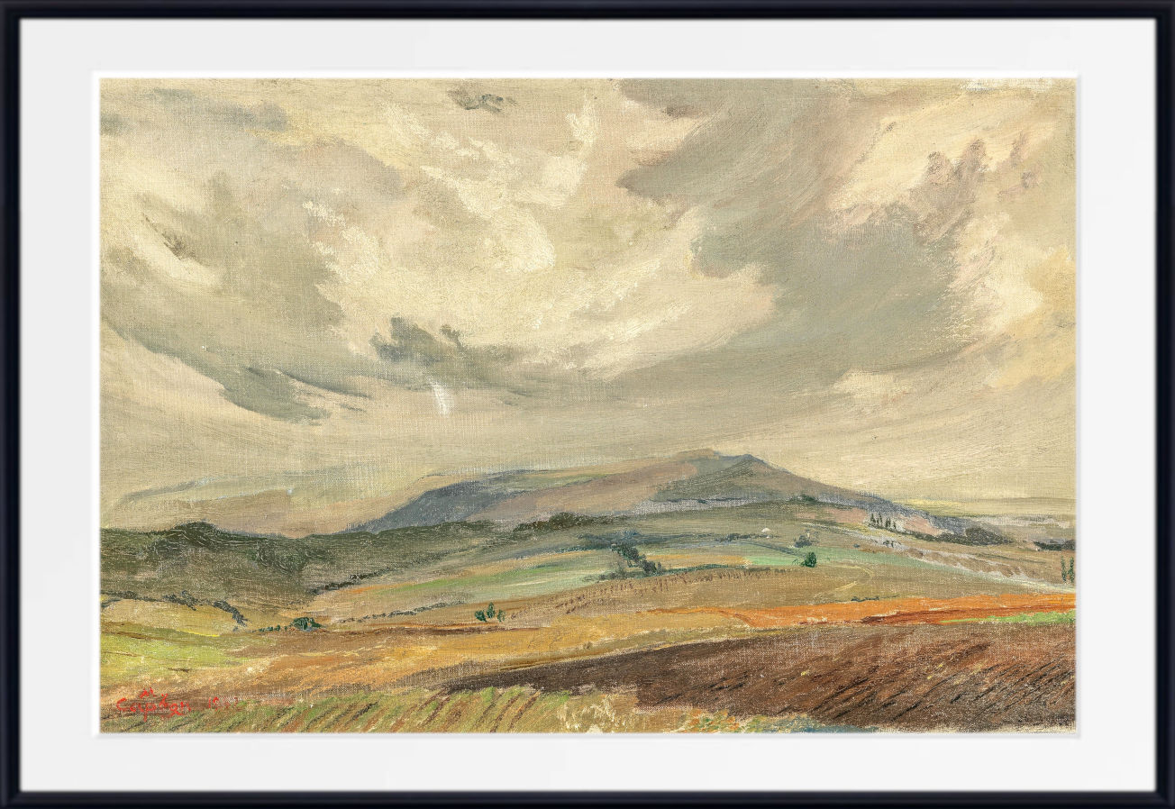 A framed landscape painting featuring rolling hills, distant mountains, and a dramatic cloudy sky, presented with a white mat and black frame.