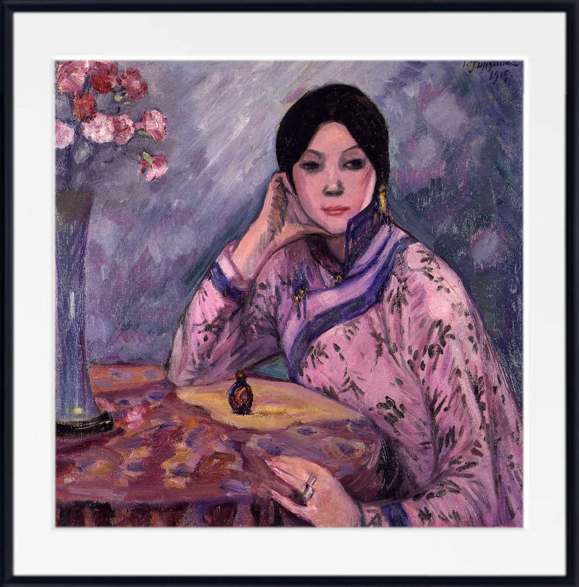 A framed painting of a woman in a pink patterned robe seated at a table with a vase of flowers, shown with a white mat and black frame.