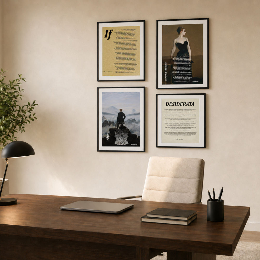 Four framed poetry prints with black frames are displayed on a beige wall above a wooden desk in a modern office setting. GalleryThane fine art prints