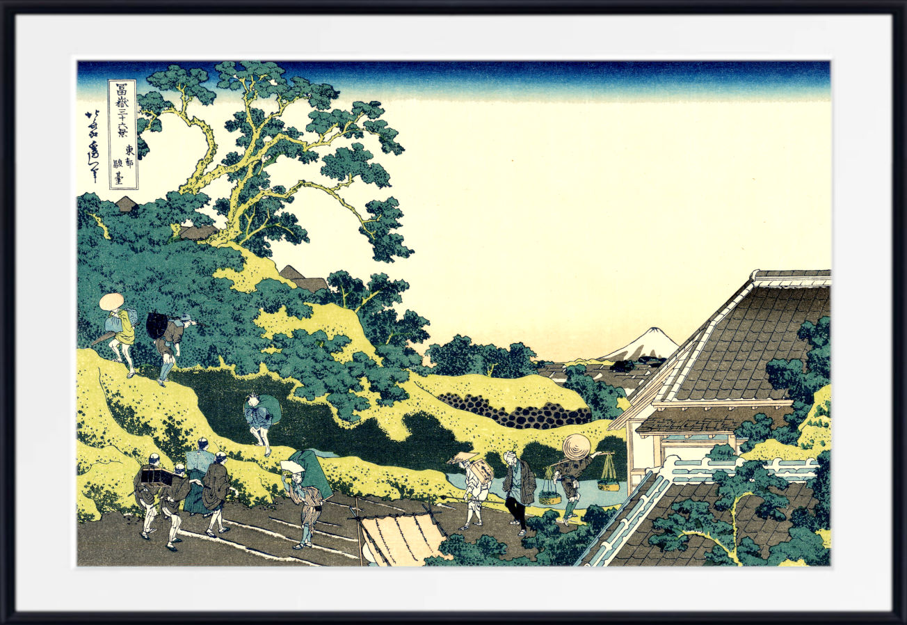A framed Japanese-style art print depicting a scenic landscape with trees, figures, a house, and distant mountains, shown against a white mat and black frame.