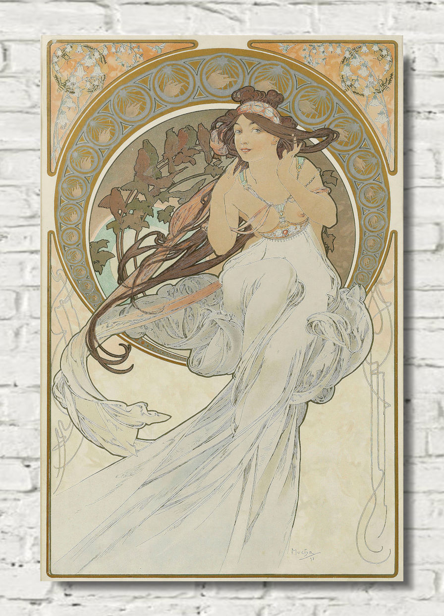 An Art Nouveau style poster print featuring a woman in a flowing white gown, mounted on a white brick wall. The artwork has ornate circular decorative elements and a warm cream, gold, and muted green palette.