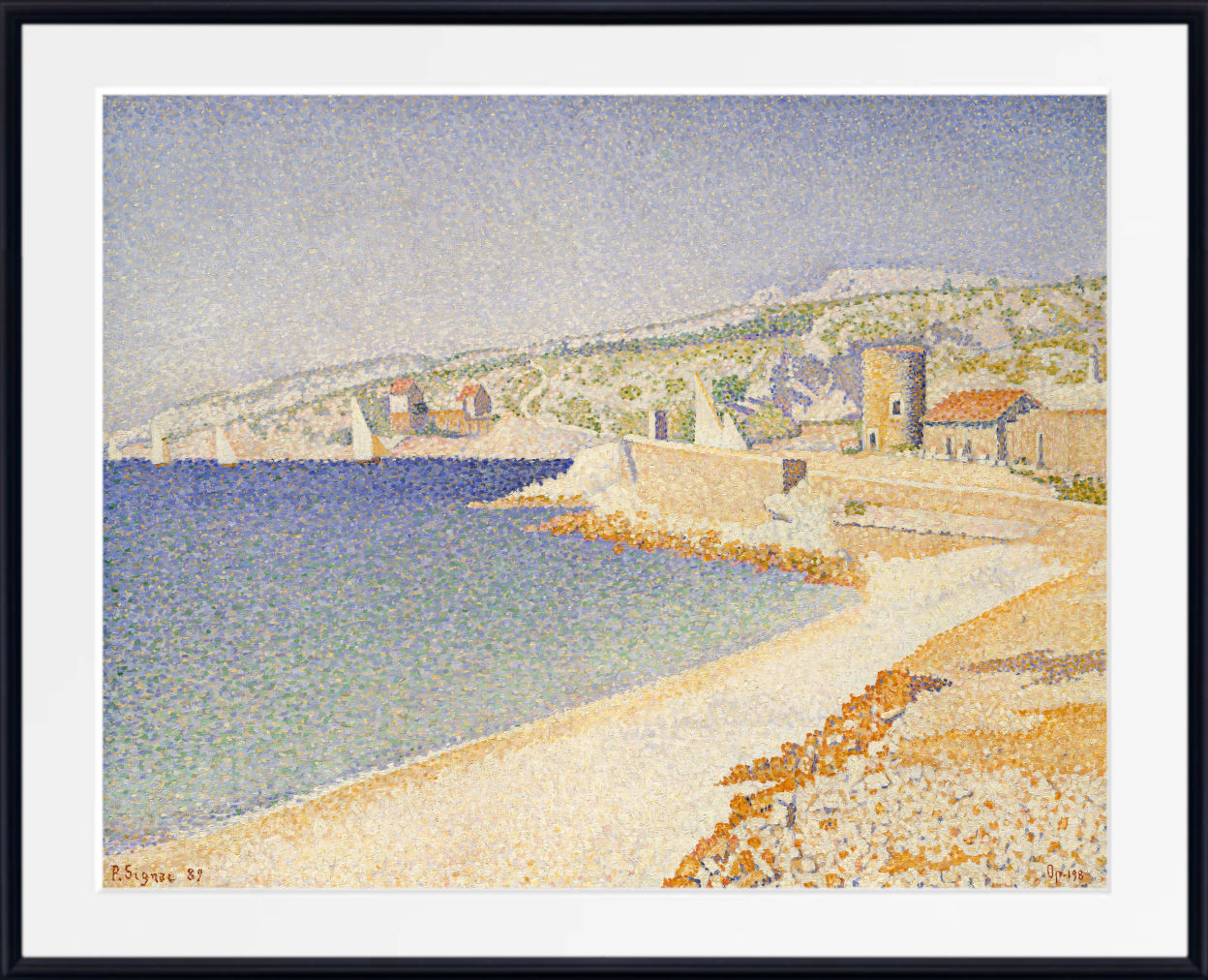 A framed pointillist painting of a coastal town with blue water, pale sandy shore, and buildings on a hillside, shown with a white mat and black frame.