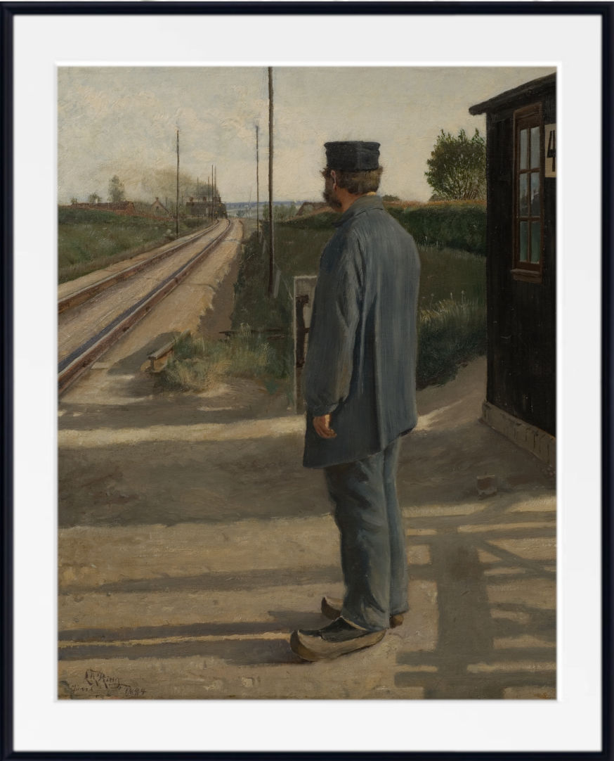 A framed art print of a classic oil painting depicting a train station scene with a guard in uniform standing by the tracks, shown with a white mat and black frame.