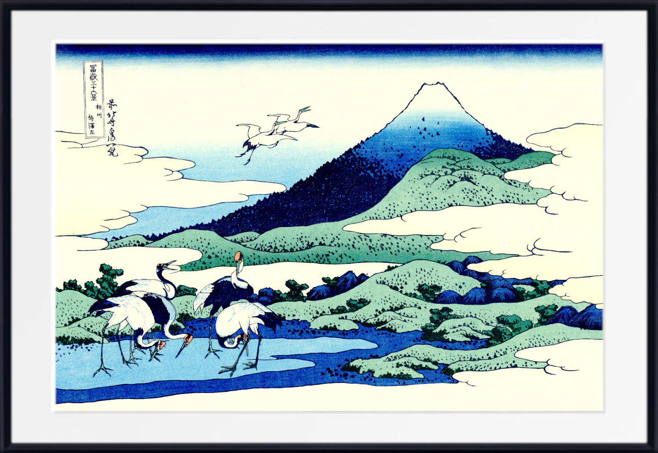 A framed Japanese-style art print depicting a mountain landscape with cranes in the foreground, shown against a white background with a black frame.
