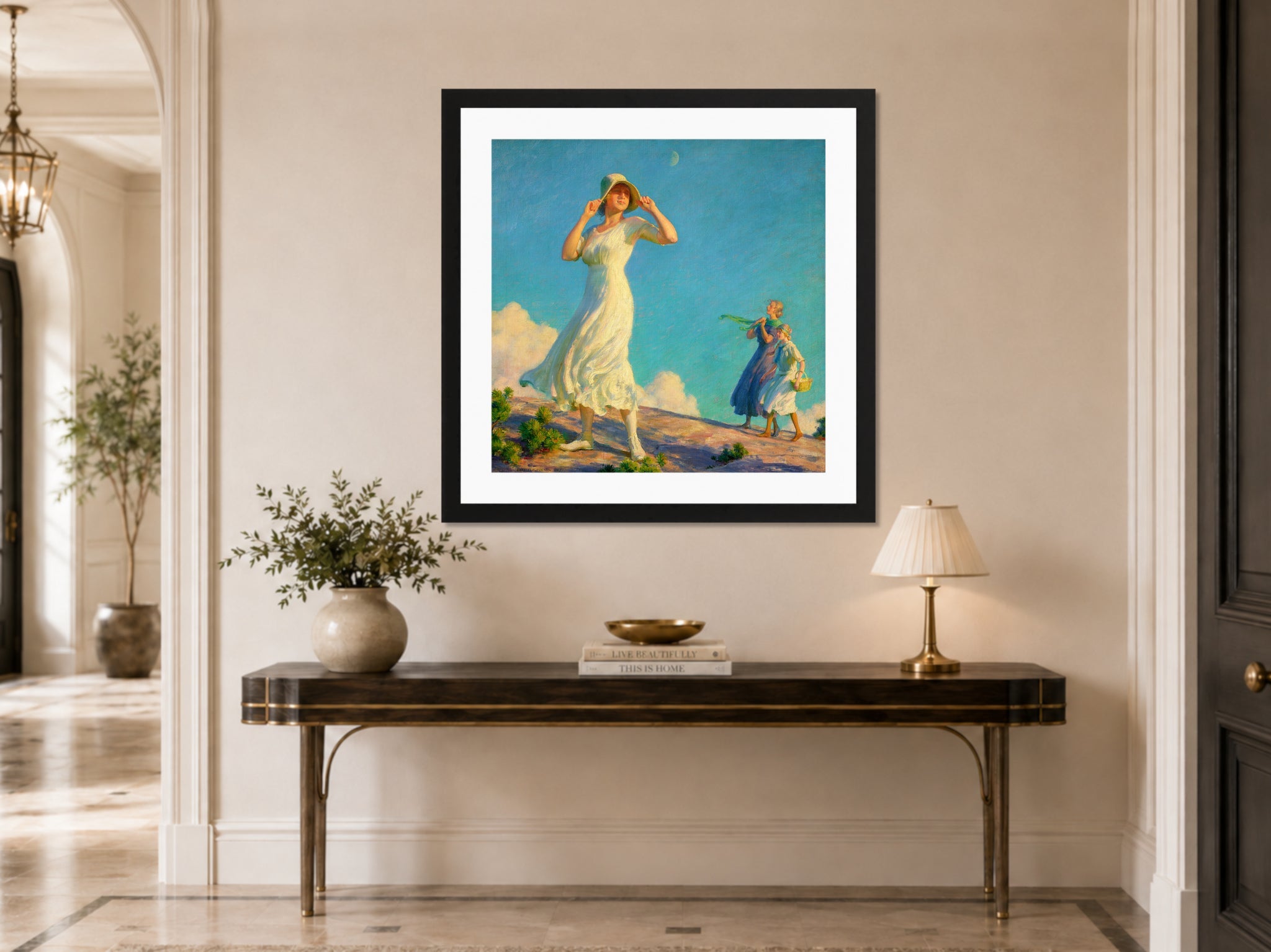 Charles Courtney Curran Print, High Country (1917) displayed above a console table