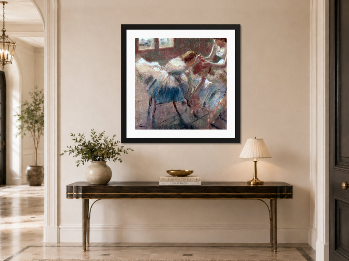 Edgar Degas Print, Three Dancers Preparing for Class (after 1878) displayed above a console table