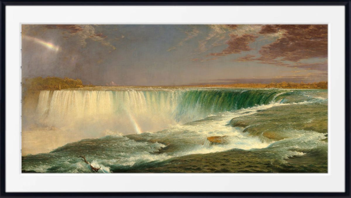 Frederic Edwin Church, Fine Art Print : Niagara Falls A framed landscape art print depicting Niagara Falls, showing the waterfall cascading into turbulent water under a dramatic cloudy sky with a faint rainbow. The print is presented with a wide white mat and a black frame.