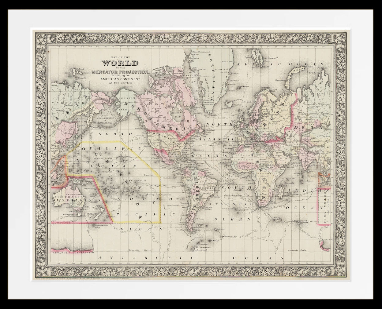 A framed vintage world map print with an ornate decorative border, shown against a white background. The map features muted pastel color coding for continents and fine cartographic details, enclosed in a black frame with a white mat.