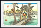 A framed Japanese-style art print depicting a rider on horseback traveling through a forest path, with trees, fields, mountains, and Japanese text visible on the artwork. The print is shown with a white mat and a black frame against a light gray background.