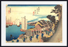 A framed Japanese ukiyo-e woodblock print depicting a harbor scene with boats, buildings, figures, and trees, shown against a white mat and black frame.