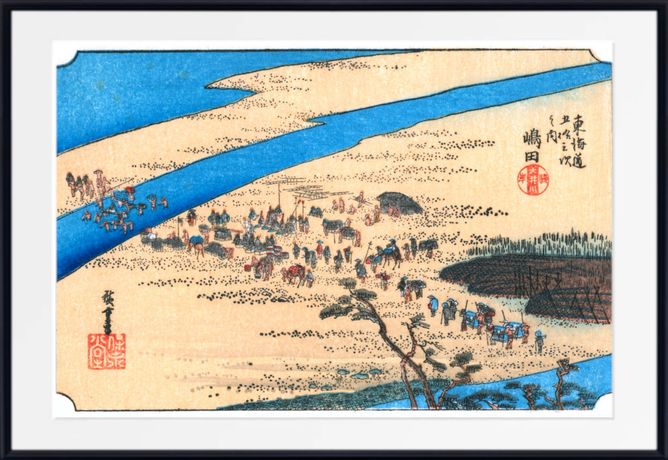 A framed Japanese-style art print depicting a river landscape with small figures and boats, shown against a light neutral background.