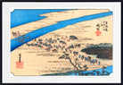 A framed Japanese-style art print depicting a river landscape with small figures and boats, shown against a light neutral background.