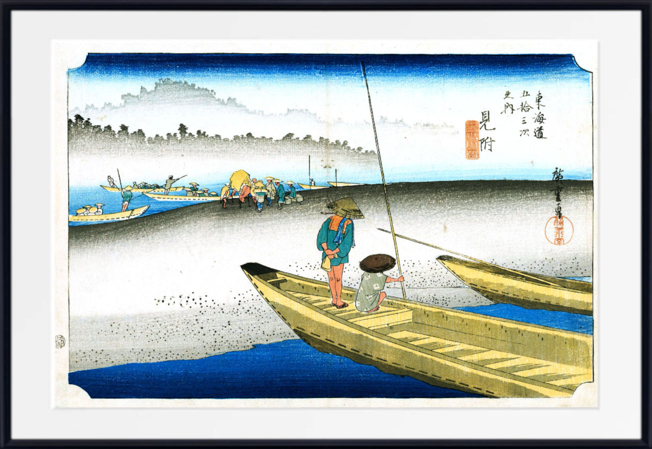 A framed Japanese ukiyo-e woodblock print depicting a figure in a boat on blue water, with other boats, distant shoreline, and Japanese text on the right side.