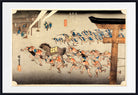 A framed Japanese ukiyo-e woodblock print depicting a dramatic street scene with a horse, running figures, and a large torii gate, shown with a white mat and black frame.