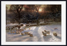 Joseph Farquharson Fine Art Print, Winter Landscape Sunset  A framed winter landscape painting featuring a snowy field with sheep, bare trees, a fence, and a bright sun near the horizon. The artwork is presented with a white mat and a black frame.