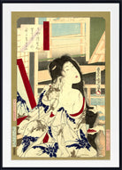 A framed Japanese ukiyo-e woodblock print featuring a woman in a white robe with blue floral patterns and red accents, shown against a beige background with a black frame.