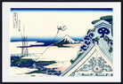 A framed Japanese-style art print depicting a snowy landscape with a snow-capped mountain, blue sky, rooftops, and a flying kite, shown against a white mat and black frame.