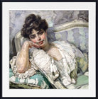 A framed painting of a woman reclining on a patterned sofa, rendered in soft pastel or impasto brushwork with muted green, cream, gray, and pink tones. The artwork is shown with a white mat and black frame against a light neutral background.