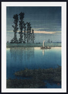 A framed Japanese-style art print depicting a tranquil lake scene at dusk or dawn, with tall dark trees on the left, a small sailboat on the water, and a pale sky. The print is shown with a white mat and a black frame.