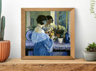 Frederick Carl Frieseke – Girl in Blue Arranging Flowers (1915) Fine Art Prints From GalleryThane