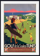 A framed vintage-style travel poster for 'GOLF de la Soukra TUNIS' hangs on a white wall above a mantel, flanked by small potted plants. The poster features retro illustration art of people playing golf on a green hillside with mountains and a pink sky in the background.