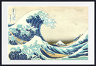 A framed art print of Katsushika Hokusai's famous 'The Great Wave off Kanagawa' woodblock print, featuring a large curling blue wave with boats and Mount Fuji in the background, presented in a black frame with a white mat.