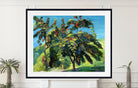 A framed landscape painting of leafy green trees with red and orange fruits under a bright blue sky, displayed on a white wall above a mantel with potted plants.