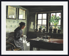 A framed art print depicting a classic oil painting of a woman in a dark dress sitting by a window with potted plants, shown with a wide white mat and black frame.