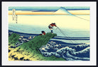 A framed Japanese-style art print depicting a coastal seascape with waves, a green cliff, two figures, and a snow-capped mountain under a pale sky, shown with a white mat and black frame.