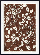 A framed art print featuring a botanical pattern of cream-colored leaves and berry clusters on a textured dark brown background, enclosed in a white mat and a black frame.