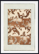 A framed art print featuring a botanical pattern with brown and beige leaves on a cream background, surrounded by a wide white mat and a black frame.