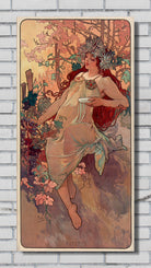 A vertical Art Nouveau style poster or print depicting a woman in flowing pale drapery seated among pink flowers and trees, mounted against a light gray brick wall.