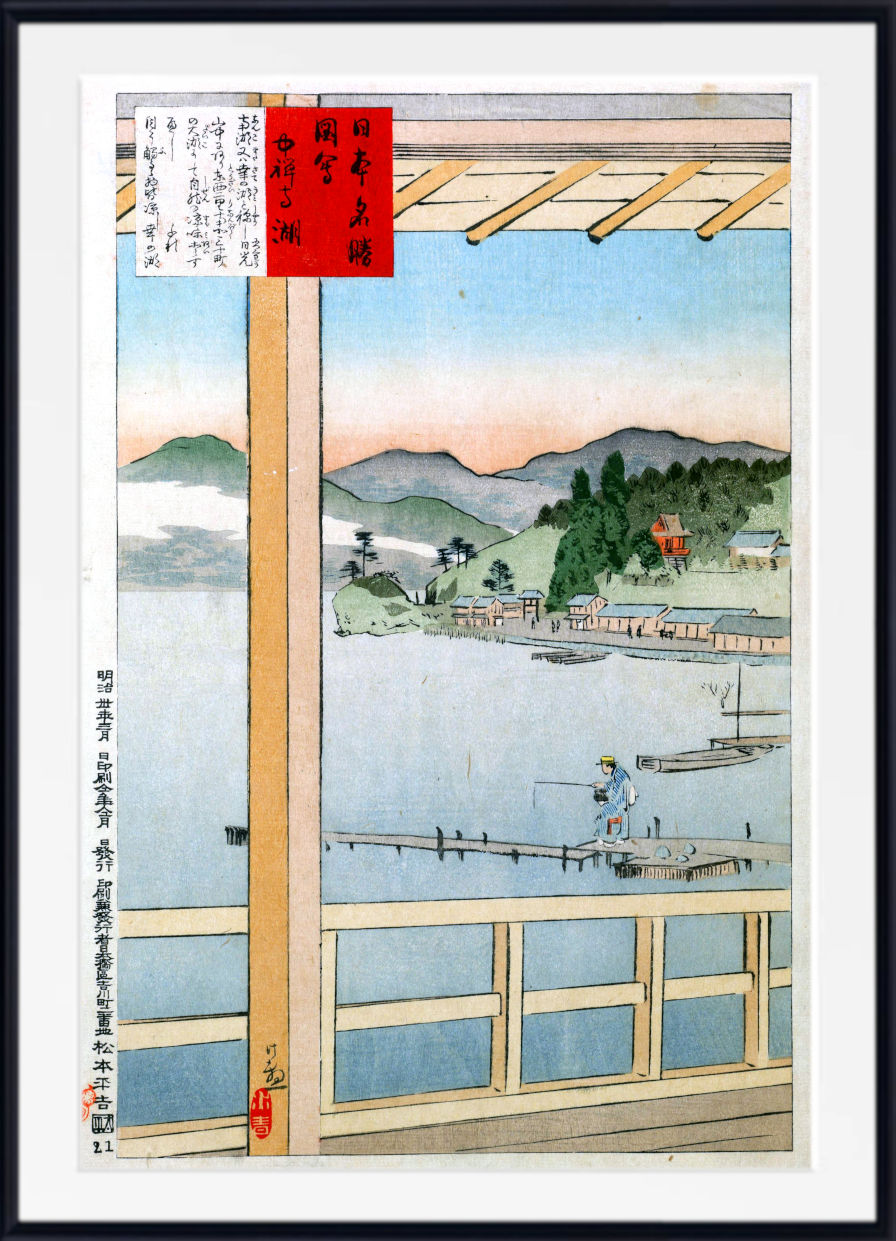 A framed Japanese ukiyo-e woodblock print depicting a scenic landscape with mountains, water, boats, and a figure on a dock, shown against a white background with a black frame.