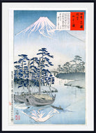 A framed Japanese woodblock-style print showing Mount Fuji, blue boats on calm water, pine trees, and calligraphic text blocks, presented against a white background with a black frame.