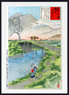 A framed Japanese ukiyo-e woodblock print depicting a mountain landscape with a river, bridge, tree, and figures, shown against a white background with a black frame.