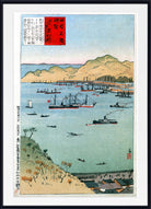 A framed Japanese ukiyo-e woodblock print depicting a harbor scene with ships, mountains, water, and buildings, shown against a white background with a black frame.