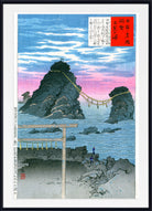 A framed Japanese ukiyo-e woodblock print depicting two rocky sea stacks connected by a suspension bridge over blue water under a pink and blue sky, with a torii gate in the foreground and Japanese text panels.