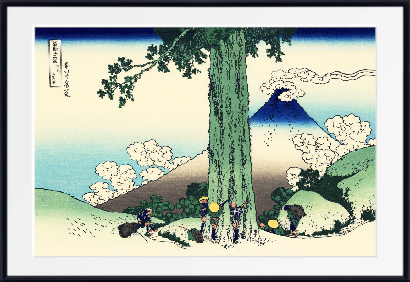 A framed Japanese-style art print depicting a large tree in the foreground, a mountain in the background, and small figures near the base of the tree, shown against a white mat and black frame.