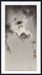A framed Japanese-style art print depicting a monkey hanging from bamboo branches, with a light gray background and a black outer frame.