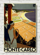 Vintage-style Monte Carlo travel poster print featuring tennis courts by the sea, with two spectators in the foreground and the text 'MONTE-CARLO' at the bottom, shown against a white brick wall.