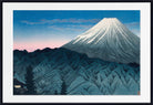 A framed Japanese-style art print depicting Mount Fuji with a snow-capped peak, blue mountains in the foreground, and a blue-to-pink sky. The print is shown with a white mat and a black frame.