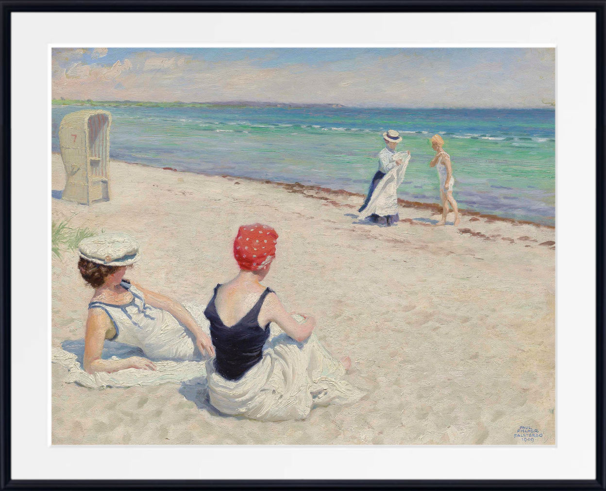 A framed beach painting showing three women on a sandy shore, with two seated in the foreground and one standing near the water. The artwork is presented with a wide white mat and a black frame.